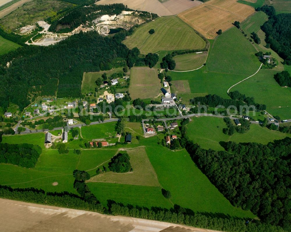 Aerial image Oberschöna - Agricultural land and field boundaries surround the settlement area of the village in Oberschöna in the state Saxony, Germany