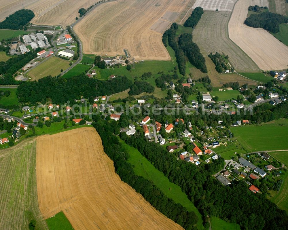 Oberschöna from above - Agricultural land and field boundaries surround the settlement area of the village in Oberschöna in the state Saxony, Germany