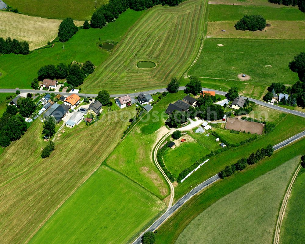 Obersteben from the bird's eye view: Agricultural land and field boundaries surround the settlement area of the village in Obersteben in the state Bavaria, Germany