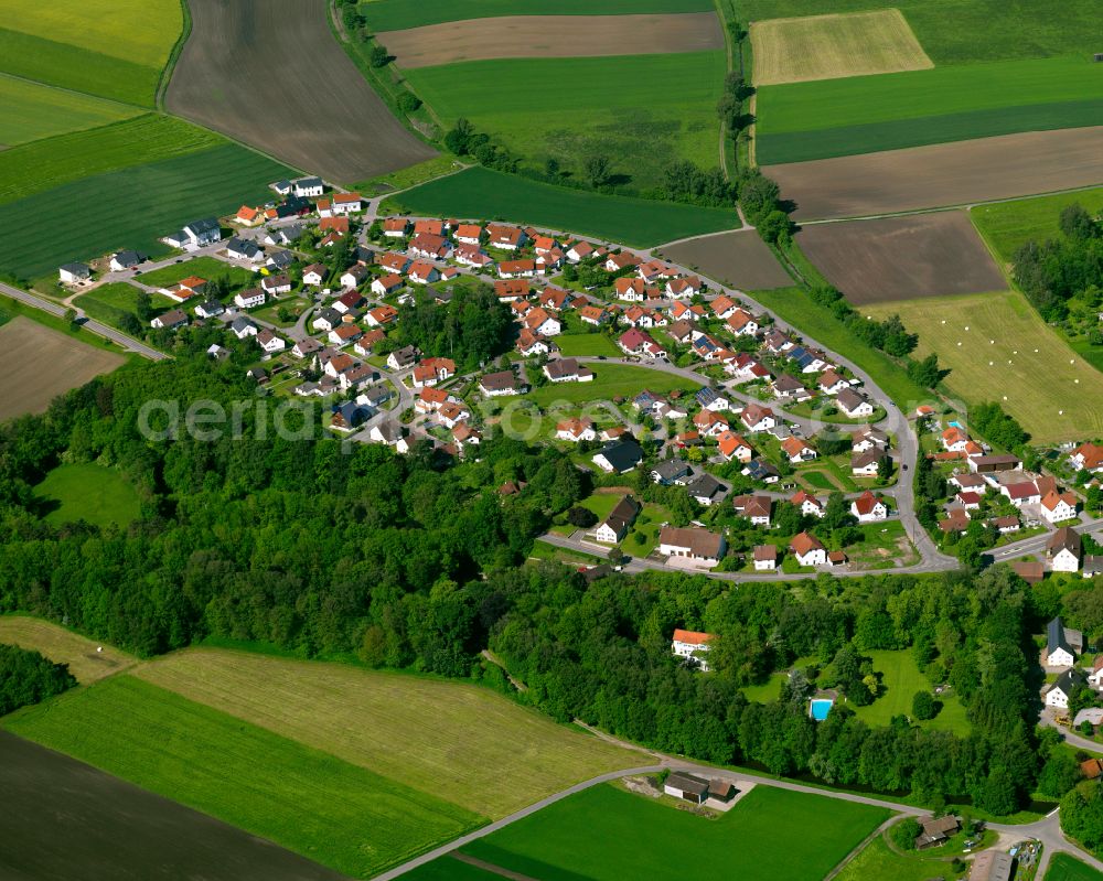 Obersulmetingen from above - Agricultural land and field boundaries surround the settlement area of the village in Obersulmetingen in the state Baden-Wuerttemberg, Germany