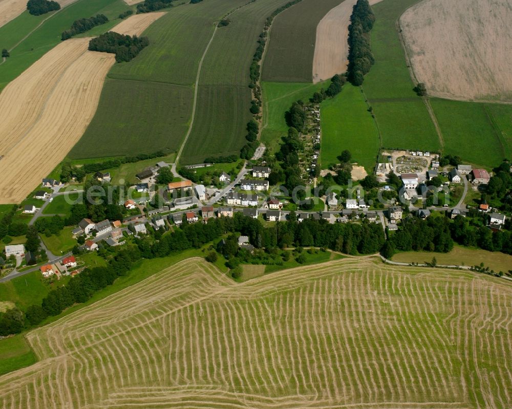 Oederan from the bird's eye view: Agricultural land and field boundaries surround the settlement area of the village in Oederan in the state Saxony, Germany