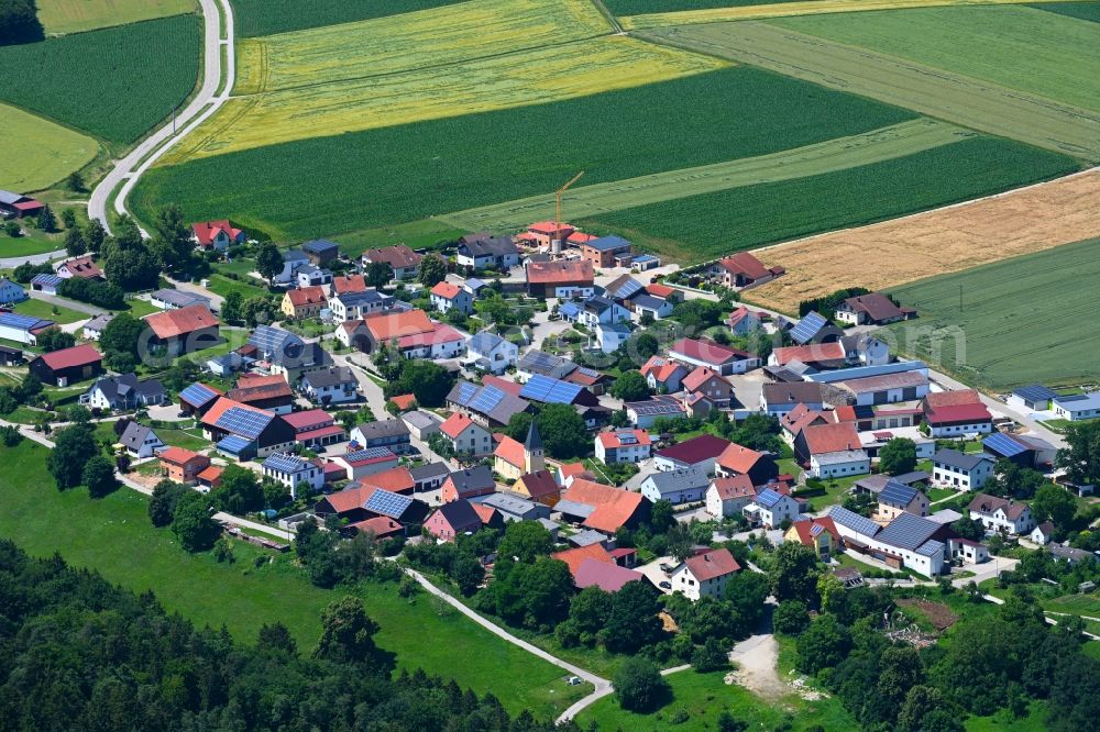 Oening from the bird's eye view: Agricultural land and field boundaries surround the settlement area of the village in Oening in the state Bavaria, Germany