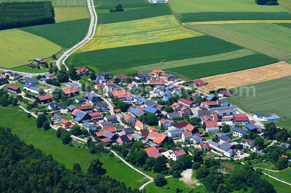 Aerial image Oening - Agricultural land and field boundaries surround the settlement area of the village in Oening in the state Bavaria, Germany