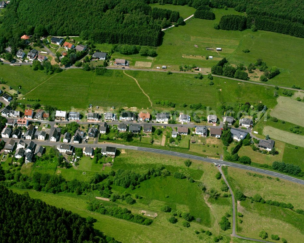 Aerial photograph Offdilln - Agricultural land and field boundaries surround the settlement area of the village in Offdilln in the state Hesse, Germany