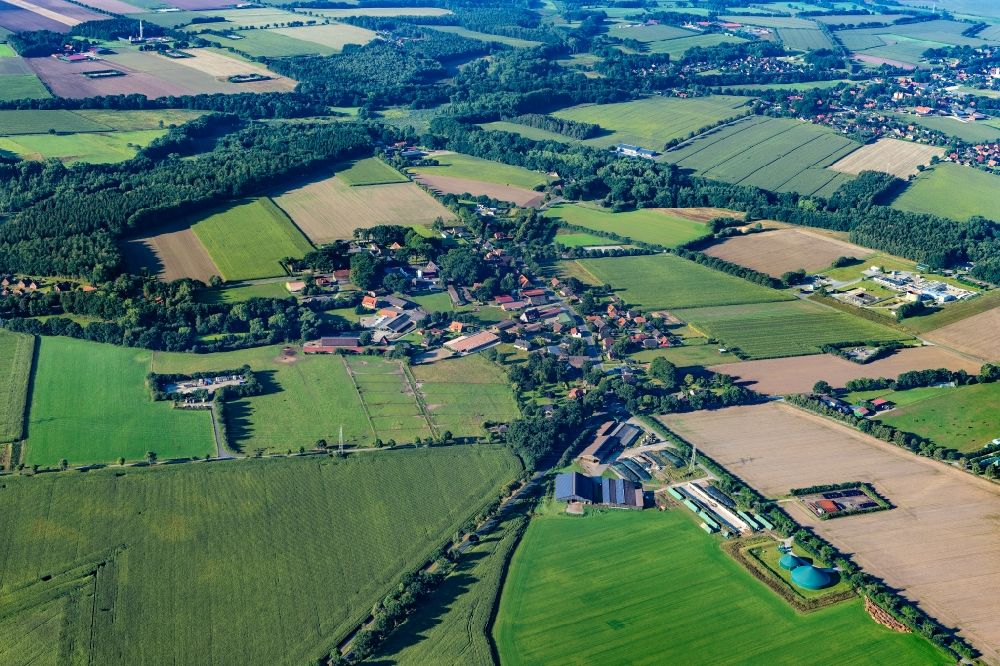 Ohrensen from the bird's eye view: Agricultural land and field boundaries surround the settlement area of the village in Ohrensen in the state Lower Saxony, Germany