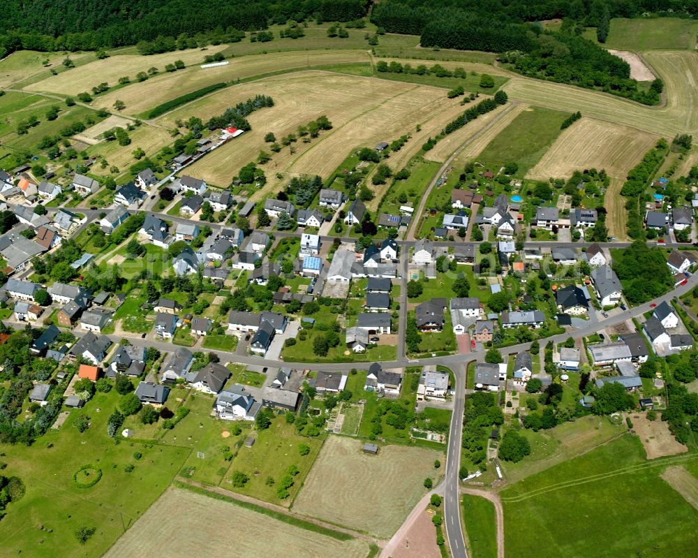 Oppenhausen from above - Agricultural land and field boundaries surround the settlement area of the village in Oppenhausen in the state Rhineland-Palatinate, Germany