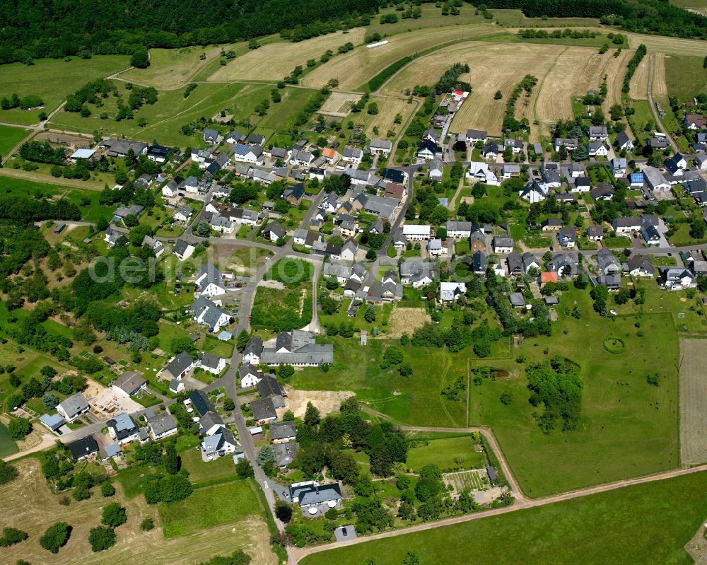 Oppenhausen from the bird's eye view: Agricultural land and field boundaries surround the settlement area of the village in Oppenhausen in the state Rhineland-Palatinate, Germany