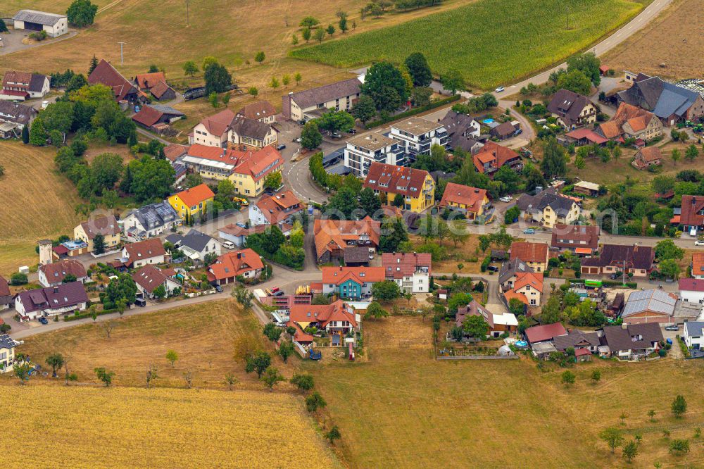 Ottoschwanden from the bird's eye view: Agricultural land and field boundaries surround the settlement area of the village in Ottoschwanden in the state Baden-Wuerttemberg, Germany