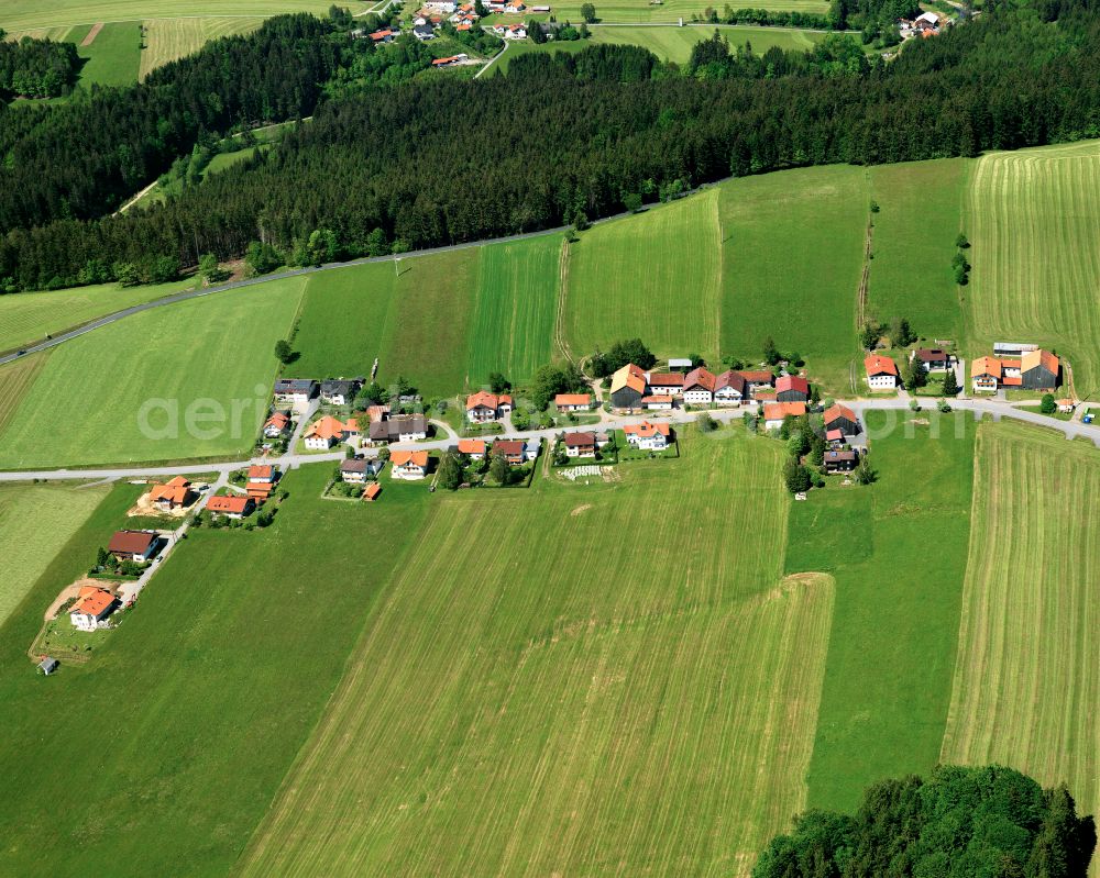 Perlesöd from above - Agricultural land and field boundaries surround the settlement area of the village in Perlesöd in the state Bavaria, Germany