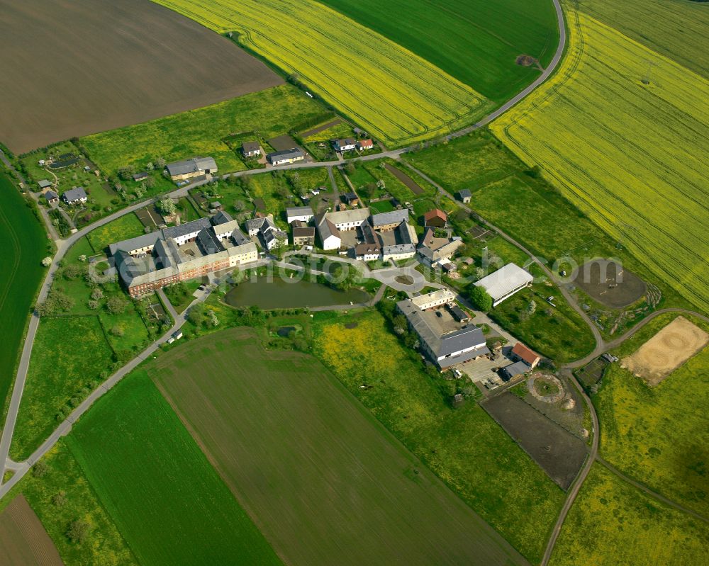 Pfersdorf from above - Agricultural land and field boundaries surround the settlement area of the village in Pfersdorf in the state Thuringia, Germany
