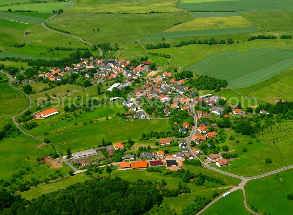 Aerial photograph Potzbach - Agricultural land and field boundaries surround the settlement area of the village in Potzbach in the state Rhineland-Palatinate, Germany