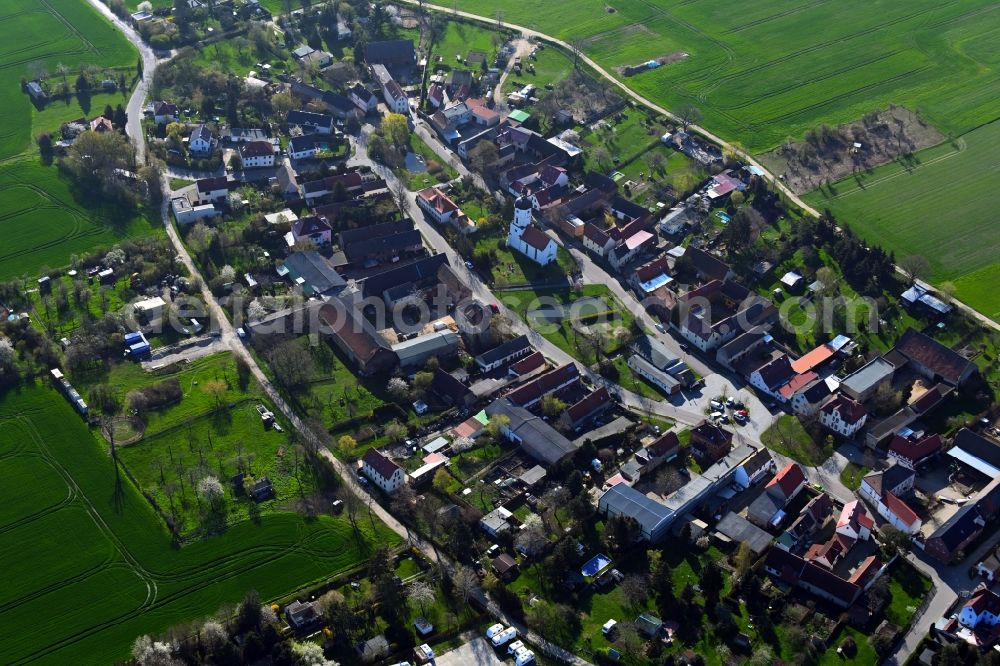 Rehbach from above - Agricultural land and field boundaries surround the settlement area of the village in Rehbach in the state Saxony, Germany