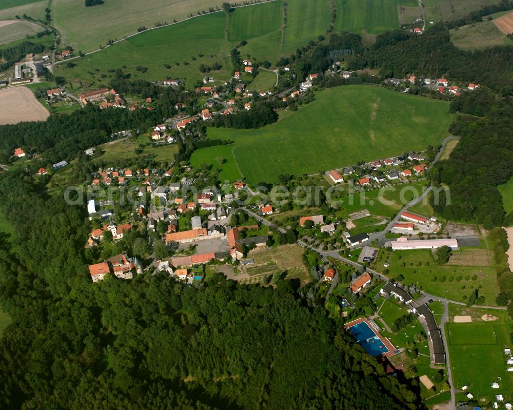 Reinsberg from above - Agricultural land and field boundaries surround the settlement area of the village in Reinsberg in the state Saxony, Germany