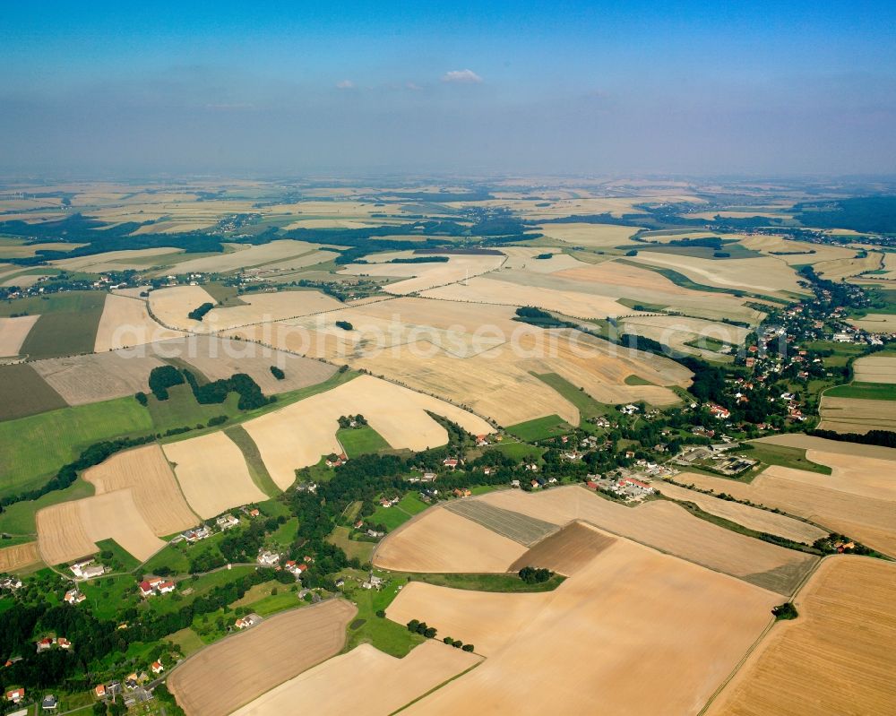 Reinsberg from the bird's eye view: Agricultural land and field boundaries surround the settlement area of the village in Reinsberg in the state Saxony, Germany