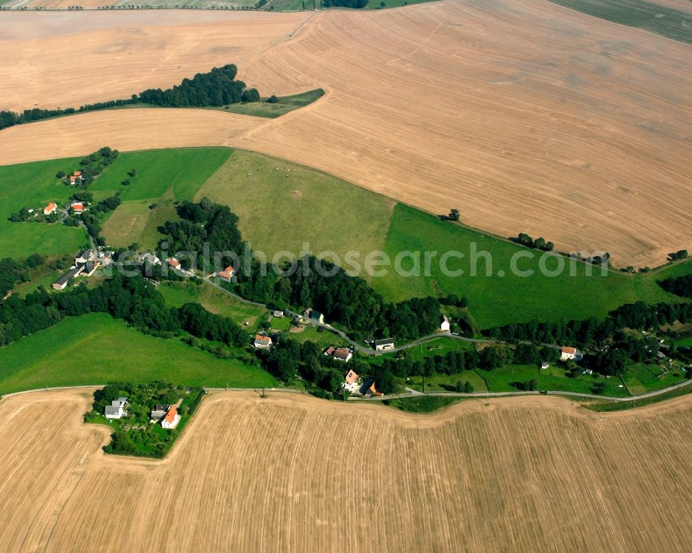 Aerial image Reinsberg - Agricultural land and field boundaries surround the settlement area of the village in Reinsberg in the state Saxony, Germany
