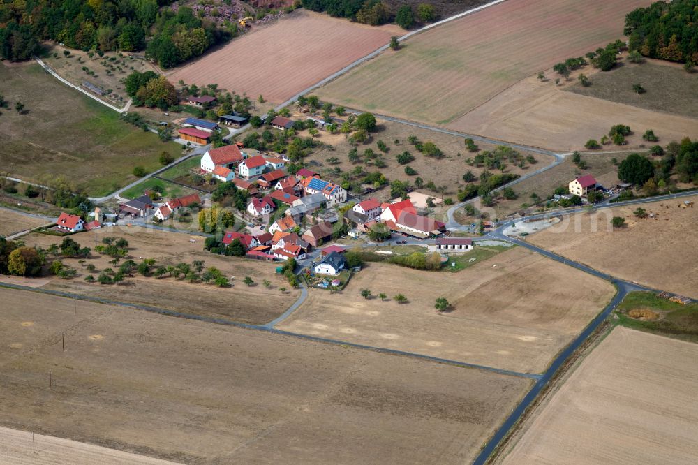 Aerial image Rettersbach - Agricultural land and field boundaries surround the settlement area of the village in Rettersbach in the state Bavaria, Germany