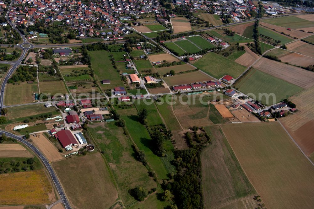 Aerial image Retzbach - Agricultural land and field boundaries surround the settlement area of the village in Retzbach in the state Bavaria, Germany