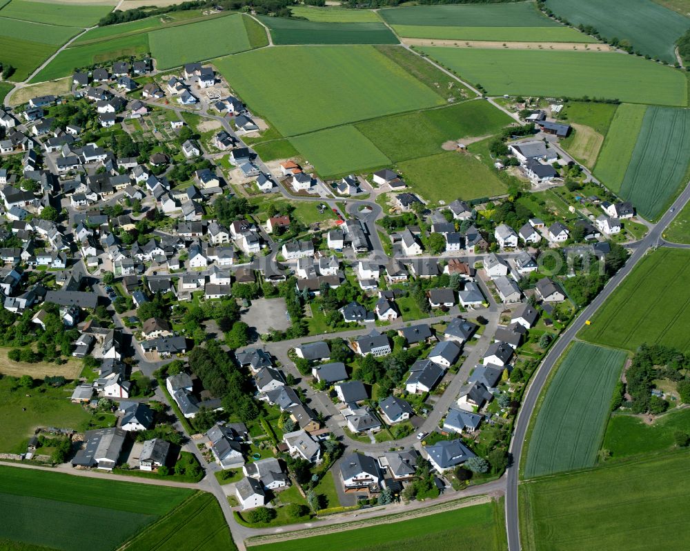 Aerial image Rheinbay - Agricultural land and field boundaries surround the settlement area of the village in Rheinbay in the state Rhineland-Palatinate, Germany