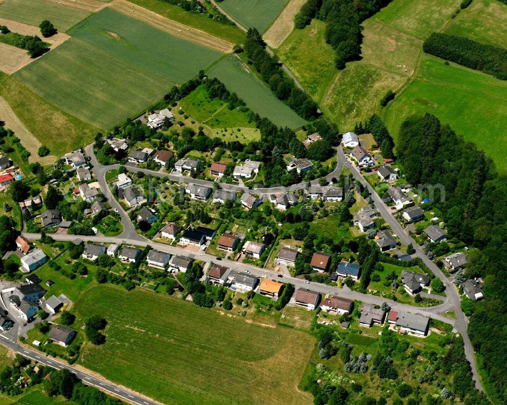 Rötsweiler-Nockenthal from the bird's eye view: Agricultural land and field boundaries surround the settlement area of the village in Rötsweiler-Nockenthal in the state Rhineland-Palatinate, Germany