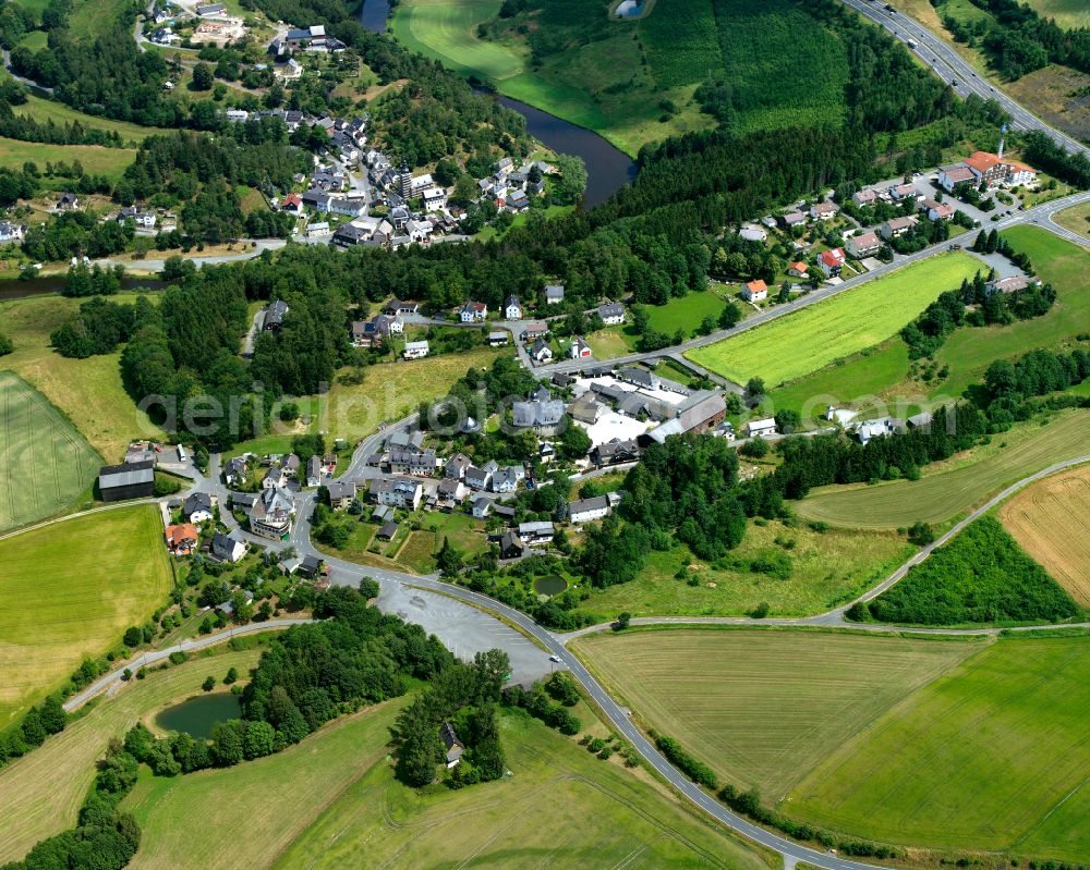 Aerial image Rudolphstein - Agricultural land and field boundaries surround the settlement area of the village in Rudolphstein in the state Bavaria, Germany