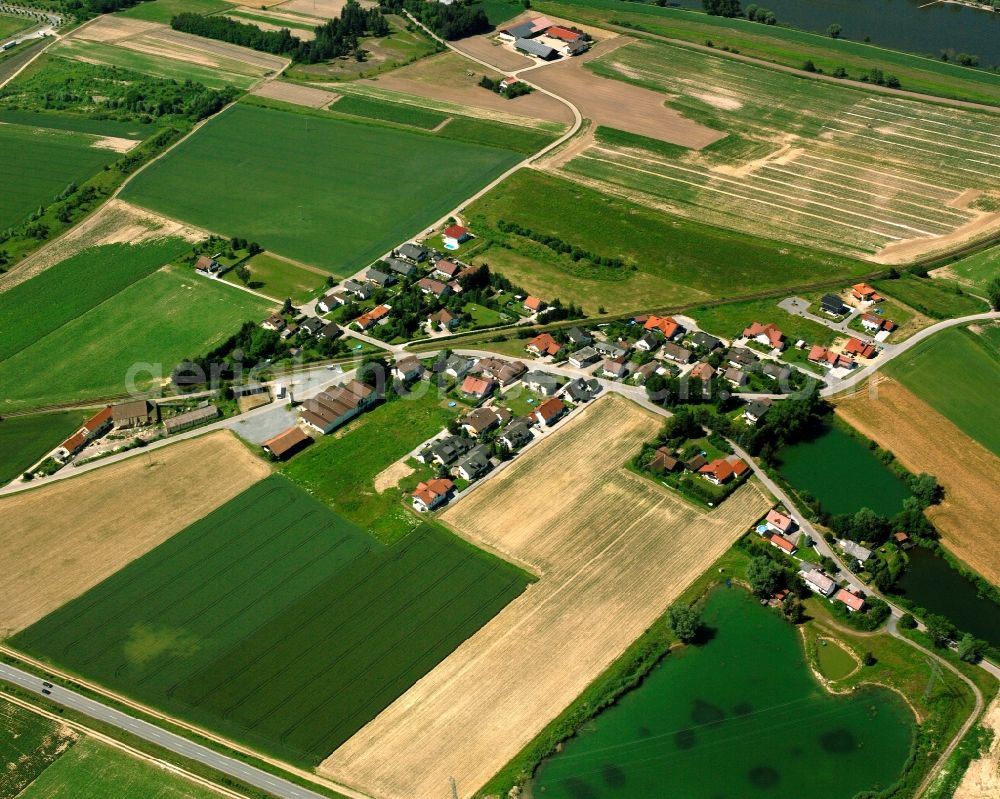Sand from the bird's eye view: Agricultural land and field boundaries surround the settlement area of the village in Sand in the state Bavaria, Germany