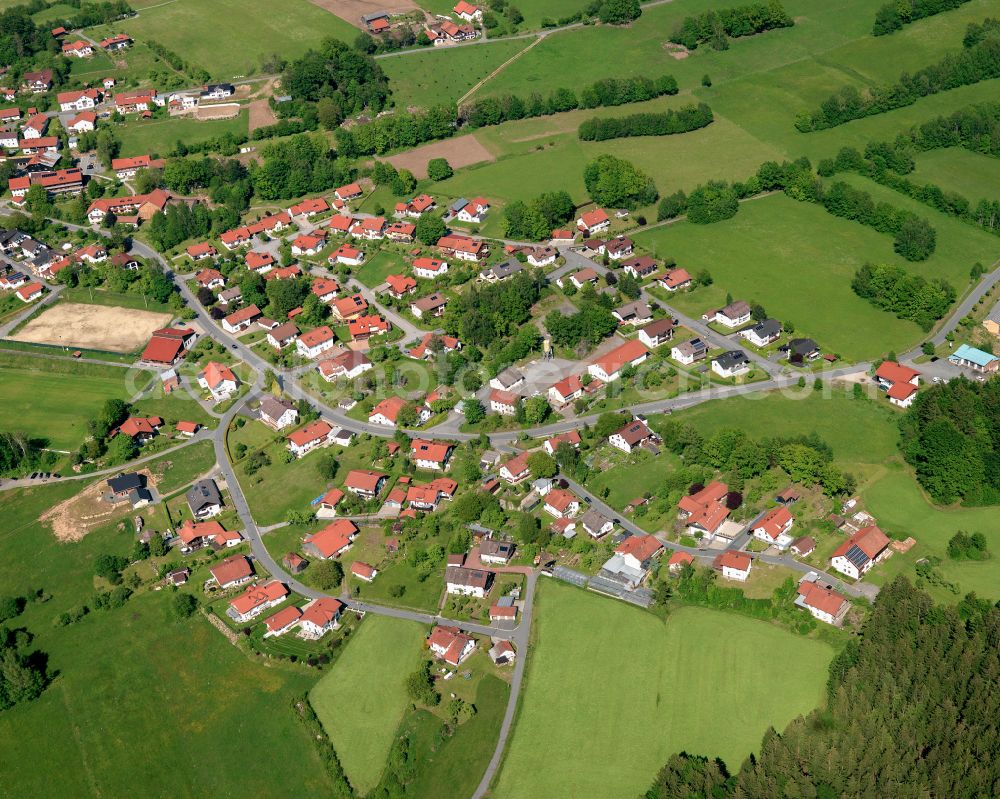 Sankt Oswald from the bird's eye view: Agricultural land and field boundaries surround the settlement area of the village in Sankt Oswald in the state Bavaria, Germany