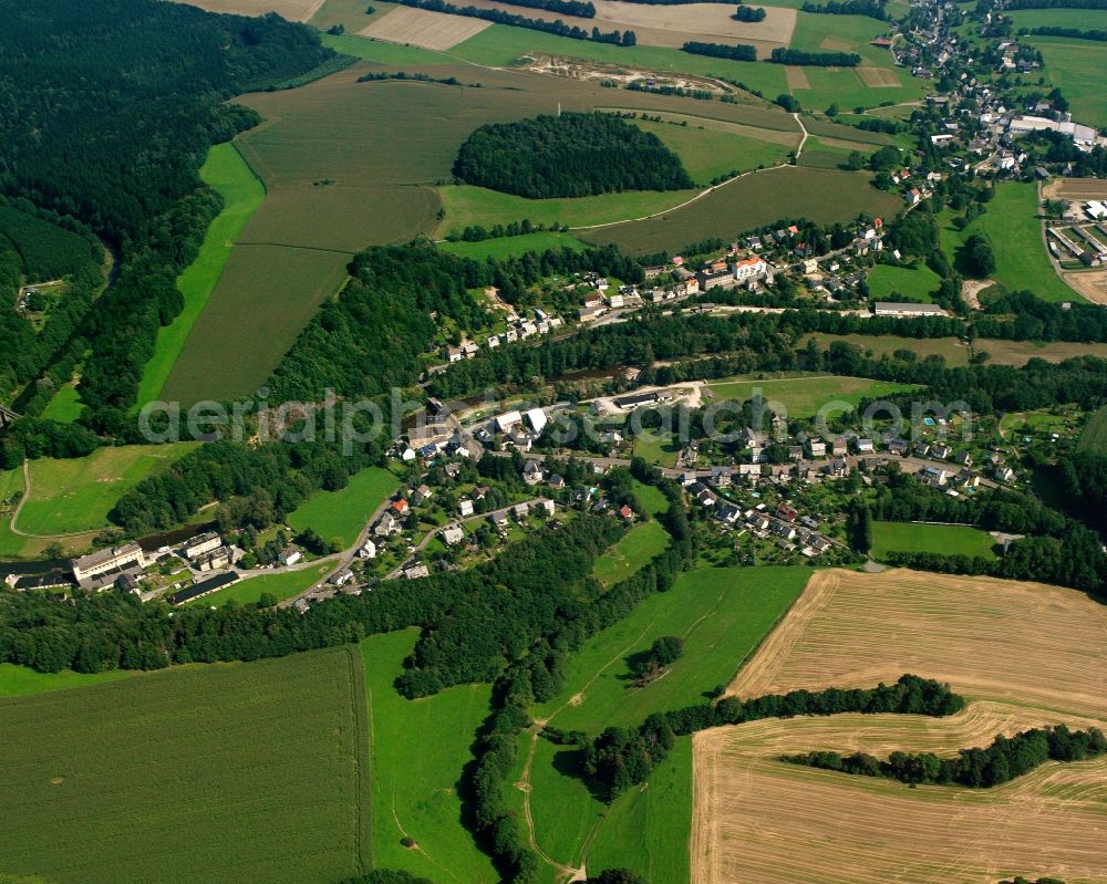 Schellenberg from the bird's eye view: Agricultural land and field boundaries surround the settlement area of the village in Schellenberg in the state Saxony, Germany