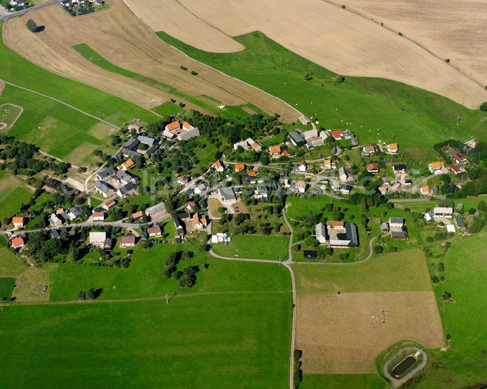 Aerial image Schlegel - Agricultural land and field boundaries surround the settlement area of the village in Schlegel in the state Saxony, Germany