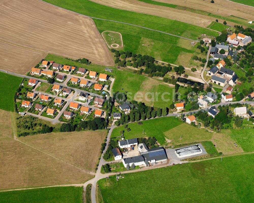 Aerial photograph Schlegel - Agricultural land and field boundaries surround the settlement area of the village in Schlegel in the state Saxony, Germany