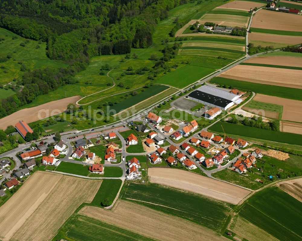 Schorndorf from above - Agricultural land and field boundaries surround the settlement area of the village in Schorndorf in the state Baden-Wuerttemberg, Germany