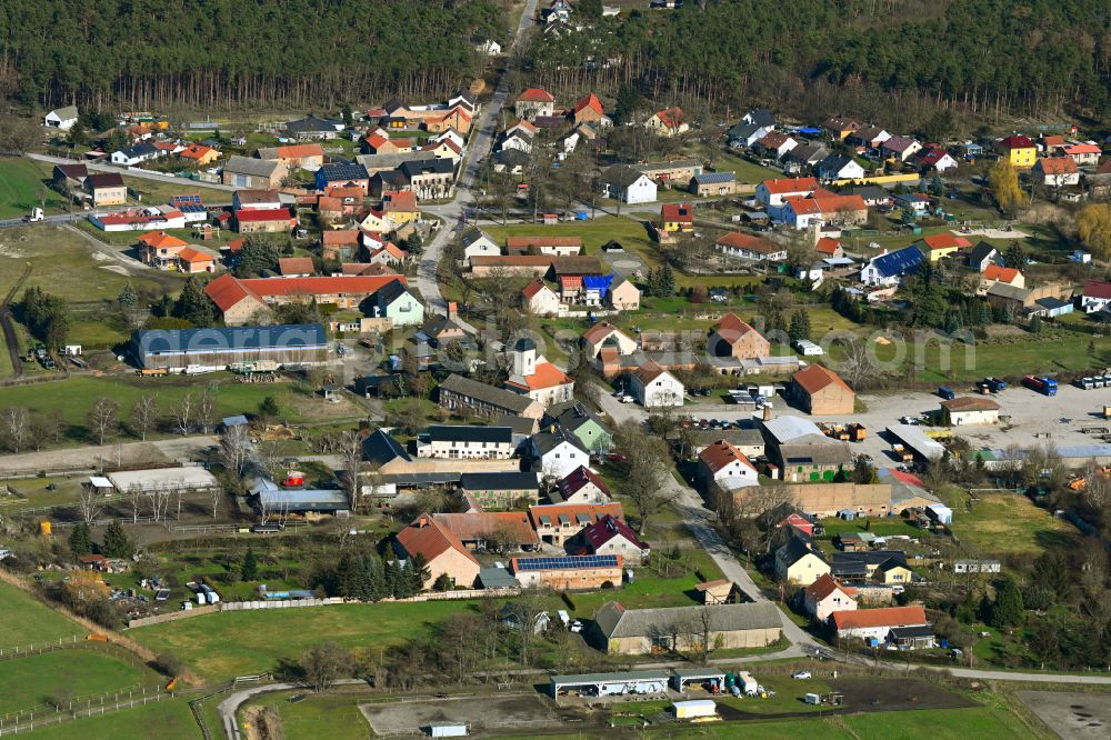 Aerial image Schünow - Agricultural land and field boundaries surround the settlement area of the village on street Zur Dorfstrasse in Schuenow in the state Brandenburg, Germany