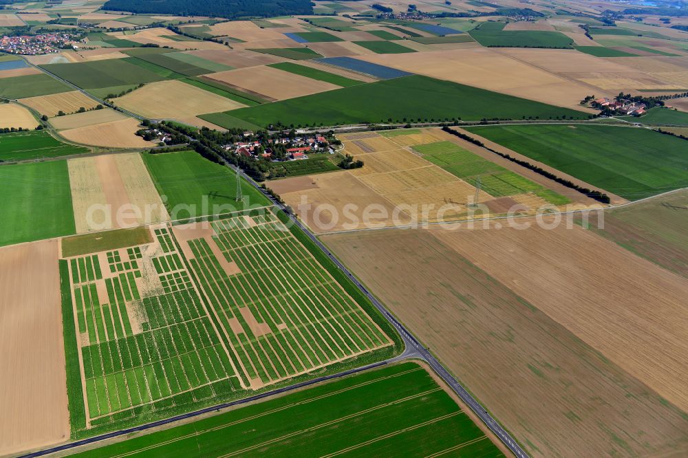 Aerial image Seligenstadt b.Würzburg - Agricultural land and field boundaries surround the settlement area of the village in Seligenstadt b.Würzburg in the state Bavaria, Germany