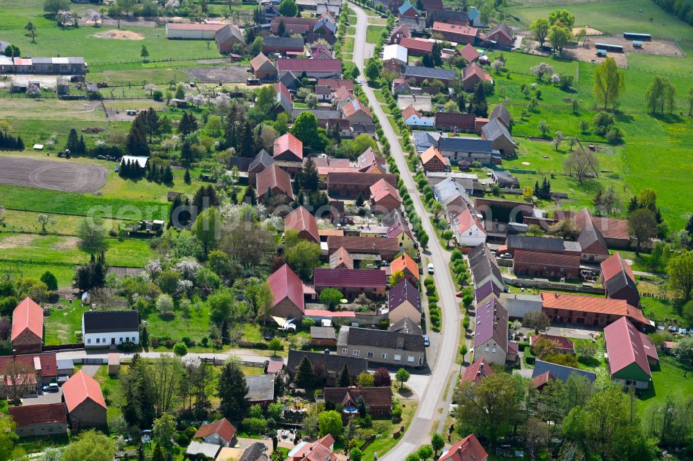 Aerial image Sieversdorf - Agricultural land and field boundaries surround the settlement area of the village in Sieversdorf in the state Brandenburg, Germany