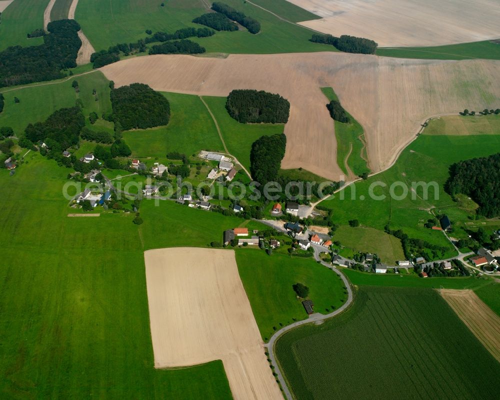 Sohra from the bird's eye view: Agricultural land and field boundaries surround the settlement area of the village in Sohra in the state Saxony, Germany