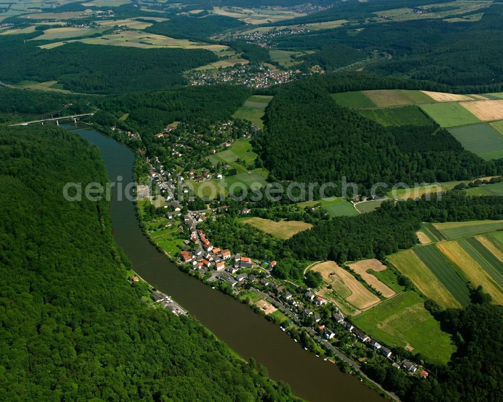 Aerial image Spiekershausen - Agricultural land and field boundaries surround the settlement area of the village in Spiekershausen in the state Lower Saxony, Germany