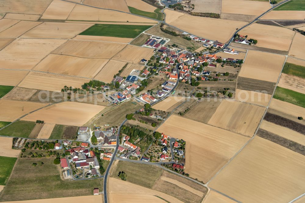 Aerial image Stadelhofen - Agricultural land and field boundaries surround the settlement area of the village in Stadelhofen at Fränkische Schweiz in the state Bavaria, Germany