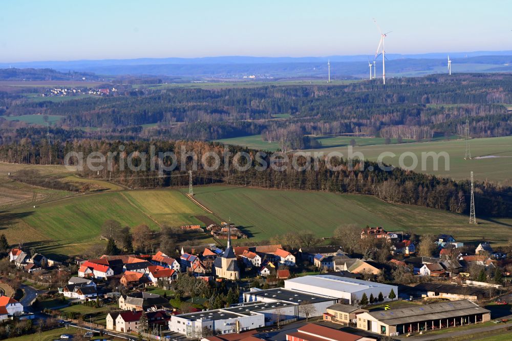 Staitz from above - Agricultural land and field boundaries surround the settlement area of the village in Staitz in the state Thuringia, Germany