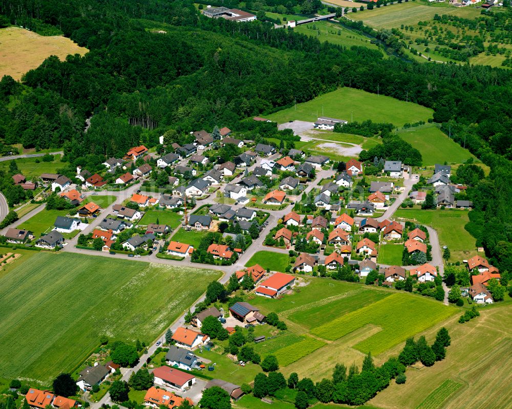 Starzach from the bird's eye view: Agricultural land and field boundaries surround the settlement area of the village in Starzach in the state Baden-Wuerttemberg, Germany