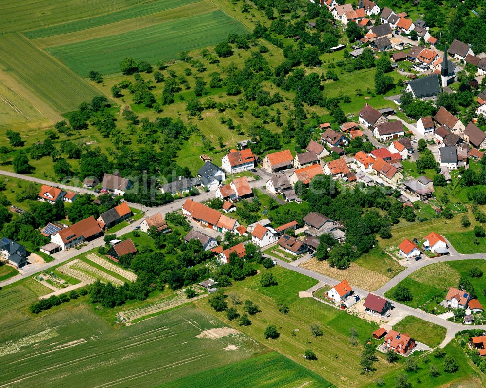 Starzach from above - Agricultural land and field boundaries surround the settlement area of the village in Starzach in the state Baden-Wuerttemberg, Germany