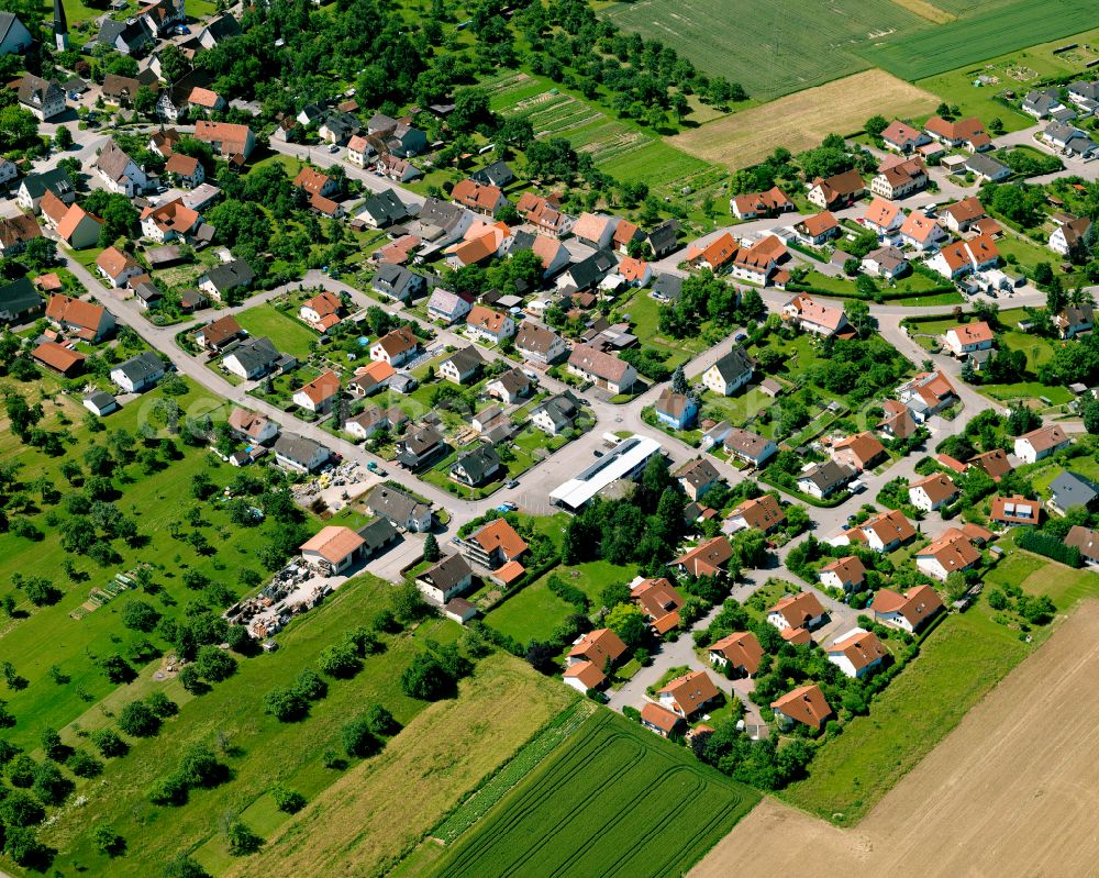 Starzach from above - Agricultural land and field boundaries surround the settlement area of the village in Starzach in the state Baden-Wuerttemberg, Germany