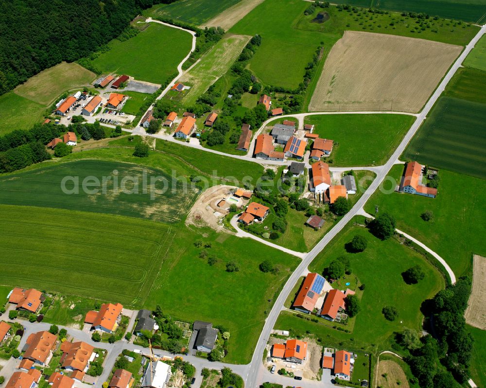 Steinbach from above - Agricultural land and field boundaries surround the settlement area of the village in Steinbach in the state Bavaria, Germany