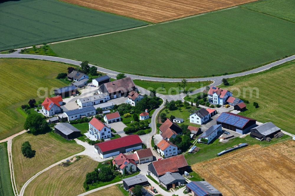 Stetterhof from above - Agricultural land and field boundaries surround the settlement area of the village in Stetterhof in the state Bavaria, Germany