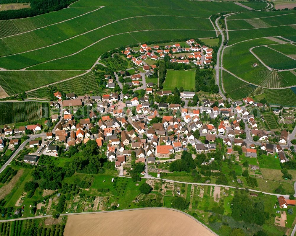 Stockheim from above - Agricultural land and field boundaries surround the settlement area of the village in Stockheim in the state Baden-Wuerttemberg, Germany