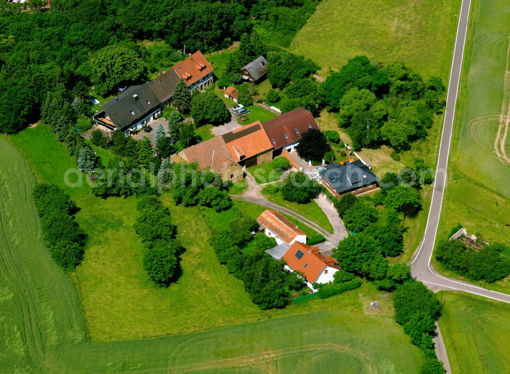 Stolzenbergerhof from above - Agricultural land and field boundaries surround the settlement area of the village in Stolzenbergerhof in the state Rhineland-Palatinate, Germany