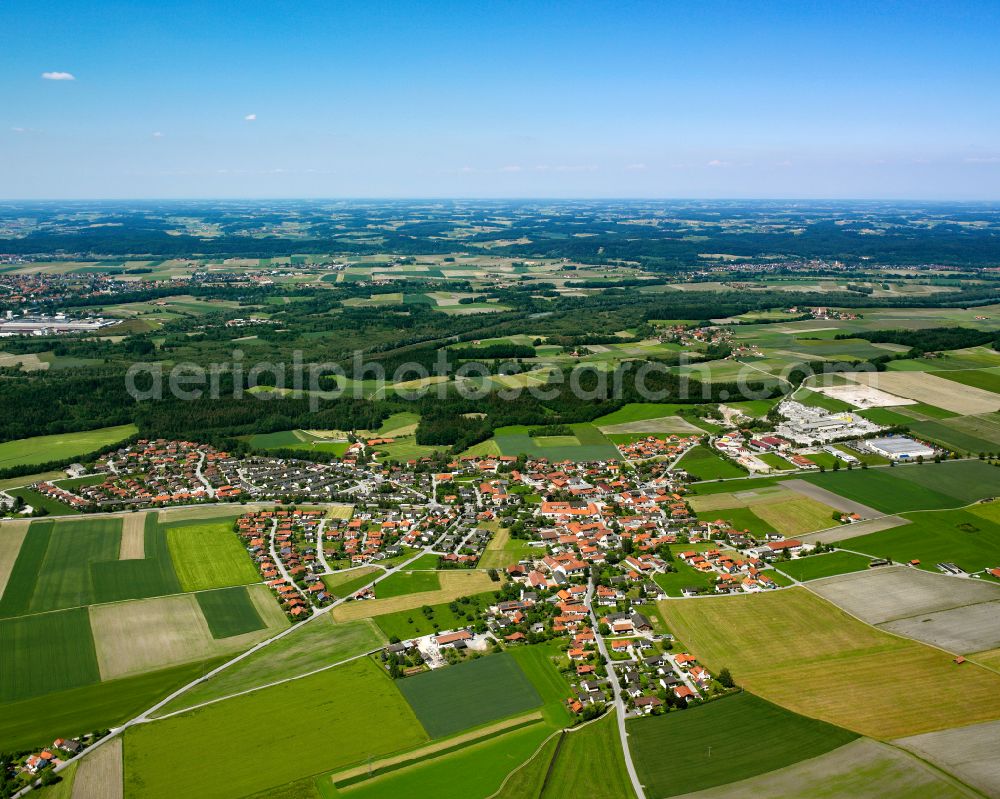 Teising from above - Agricultural land and field boundaries surround the settlement area of the village in Teising in the state Bavaria, Germany