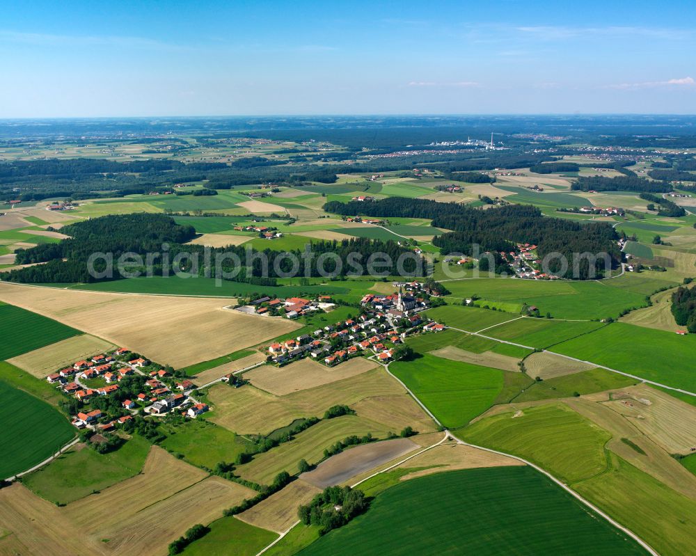 Thalhausen from above - Agricultural land and field boundaries surround the settlement area of the village in Thalhausen in the state Bavaria, Germany