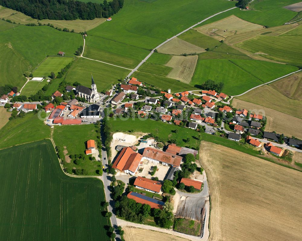 Thalhausen from the bird's eye view: Agricultural land and field boundaries surround the settlement area of the village in Thalhausen in the state Bavaria, Germany
