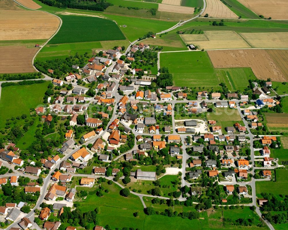 Thalheim from the bird's eye view: Agricultural land and field boundaries surround the settlement area of the village in Thalheim in the state Baden-Wuerttemberg, Germany