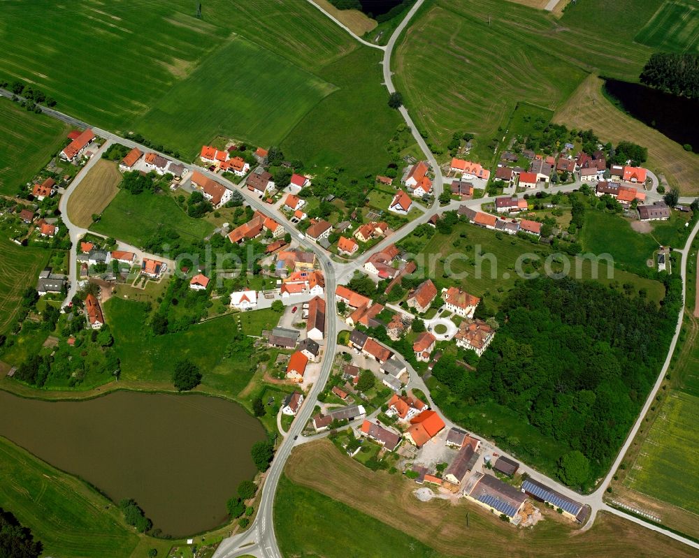 Thürnhofen from the bird's eye view: Agricultural land and field boundaries surround the settlement area of the village in Thürnhofen in the state Bavaria, Germany