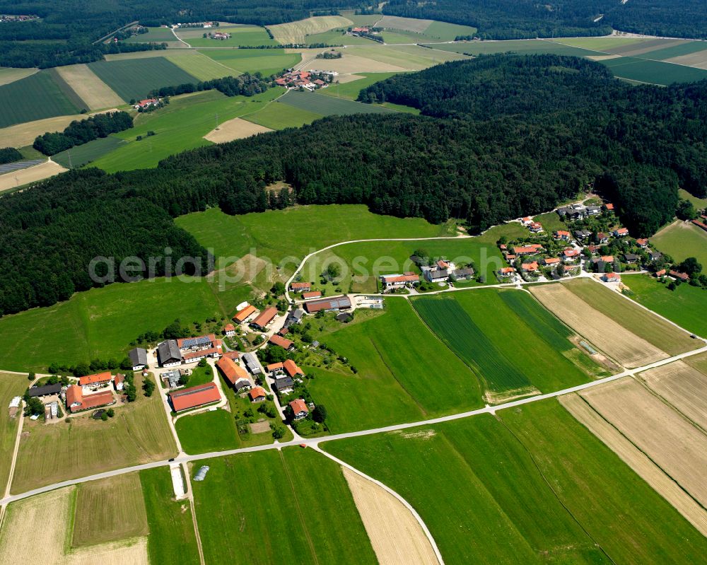 Aerial image Unghausen - Agricultural land and field boundaries surround the settlement area of the village in Unghausen in the state Bavaria, Germany
